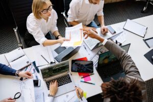 workforce management remote hybrid teams bangladesh: a diverse team collaborating in a modern office