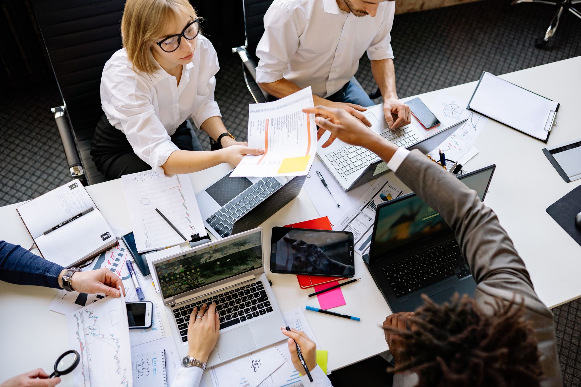 workforce management remote hybrid teams bangladesh: a diverse team collaborating in a modern office