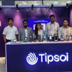 Tipsoi team standing at their branded booth with attendance and access control devices on display at ISEB 2026