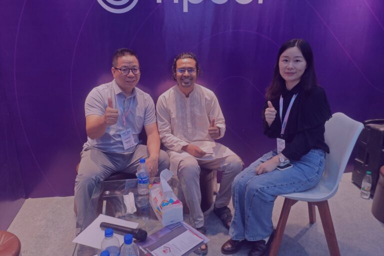 Tipsoi team members with international guests at the ISEB 2026 booth